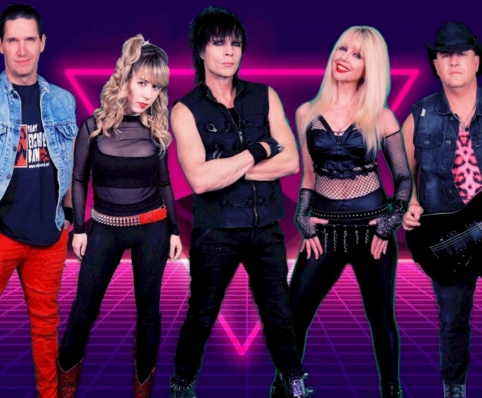 A group of people striking poses in front of a neon background, creating a vibrant and bold visual with their certified wild energy.