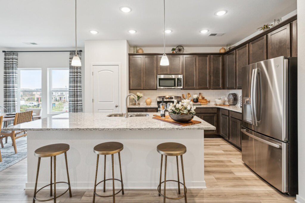 David Weekley Homes Mainstreet Townhome model at Kinston showing a modern kitchen